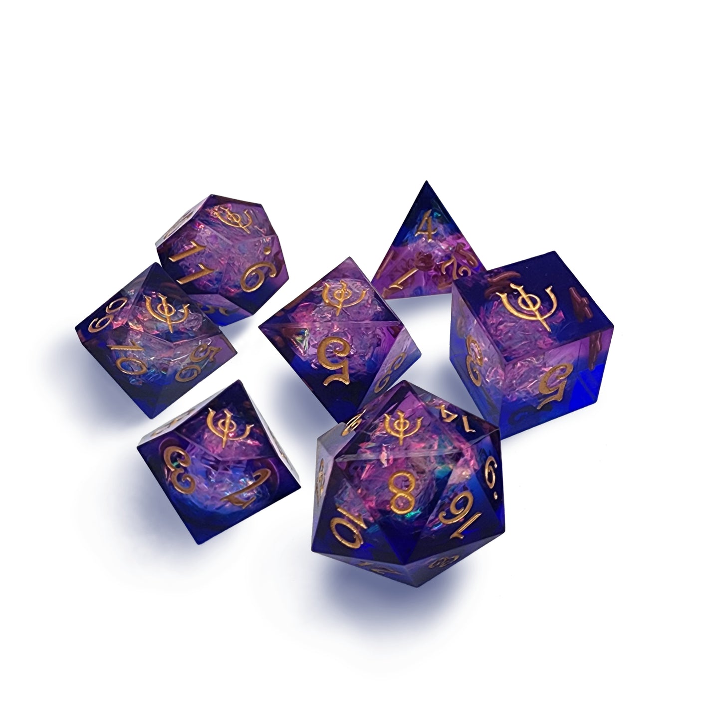 Photo of the mysteries of magic 7-piece sharp edged resin dice set with blue and magenta resin and a foil insert that gives a liquid flame appearance
