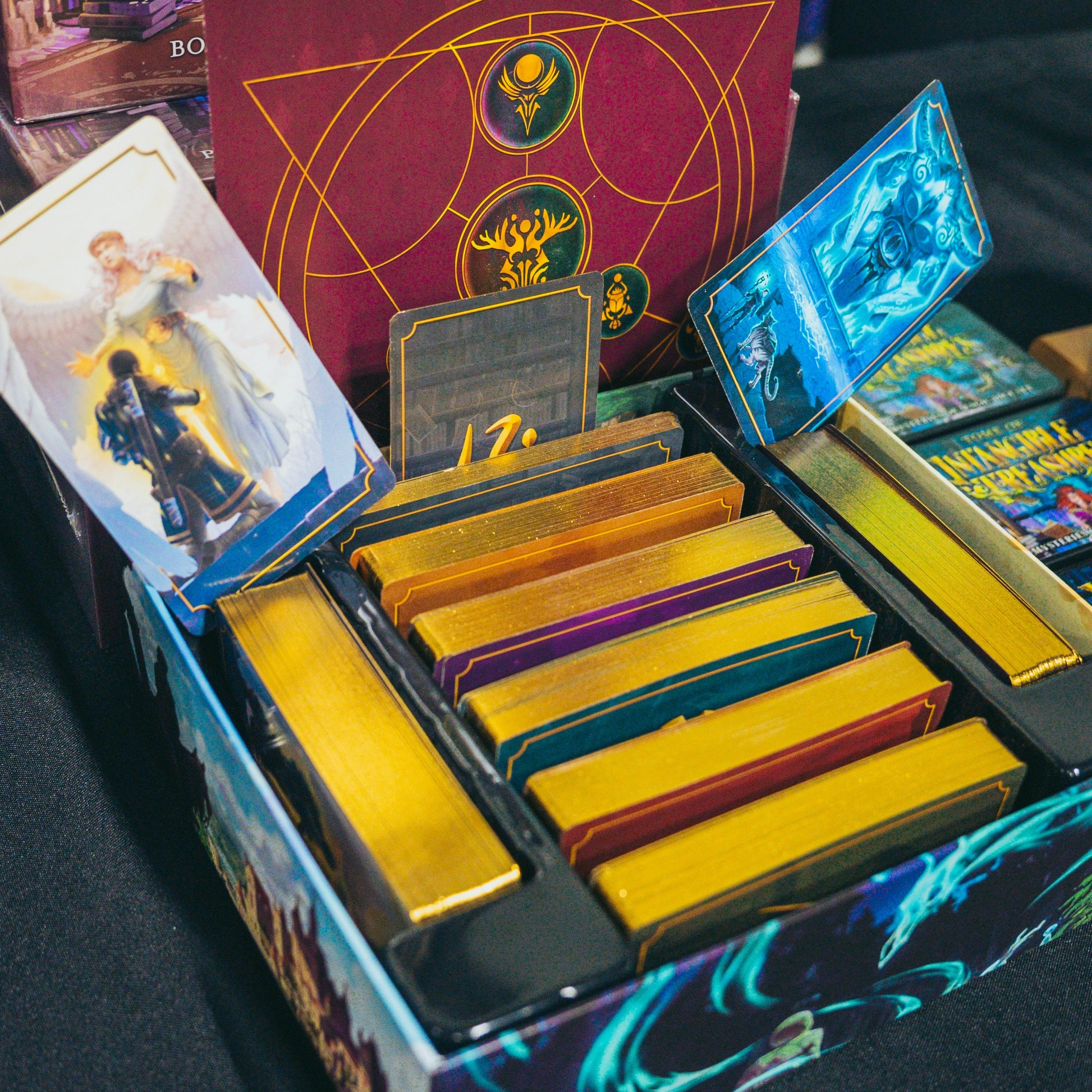 Photo of the contents of the box of intangible treasures and its tarot-sized reference cards for boons, charms, and pacts for D&D 5th edition