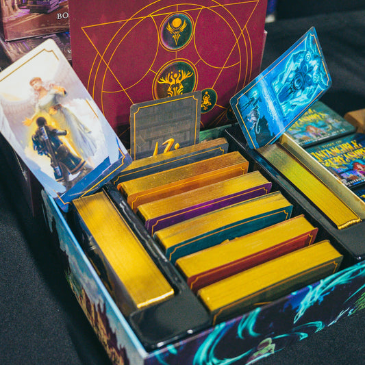 Photo of the contents of the box of intangible treasures and its tarot-sized reference cards for boons, charms, and pacts for D&D 5th edition